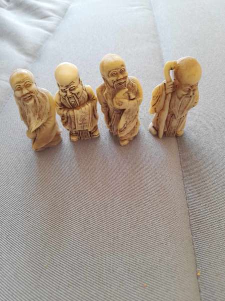 Lot de 4 figurines  - bouddhas rieurs
