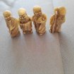 Lot de 4 figurines - bouddhas rieurs
