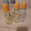Lot 5 biberons en plastiques