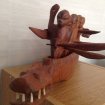 Pirogue et piroguiers sculptures en bois pas cher