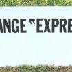 Plaque publicitaire de garage vidange express
