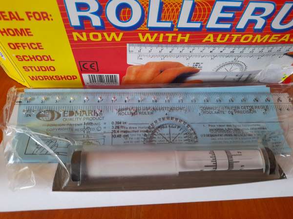 R&egrave;gle avec rouleau de mesure automatique